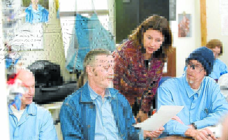 THEIR WORDS, AUDREY’S MUSIC: Inmates reveal their talents to Audrey during the first of many songwriting workshops in San Quentin. Photo: Peter Mertz
