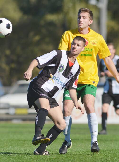 Will Kam and South Armidale’s  Tom White watch the outcome of this play. White and his South teammates won 3-1. Photo: Barry Smith 200914BSE15