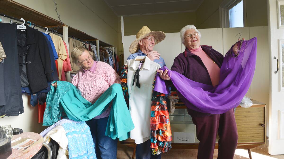 PLAYING DRESS UPS: Secretary Judy Brady, left, president Trevor Mullins, and entertainment officer Beth Brodbeck from Barraba Senior Citizens are looking for more cast members to come play along with them.  Photo: Barry Smith  290715BSD01