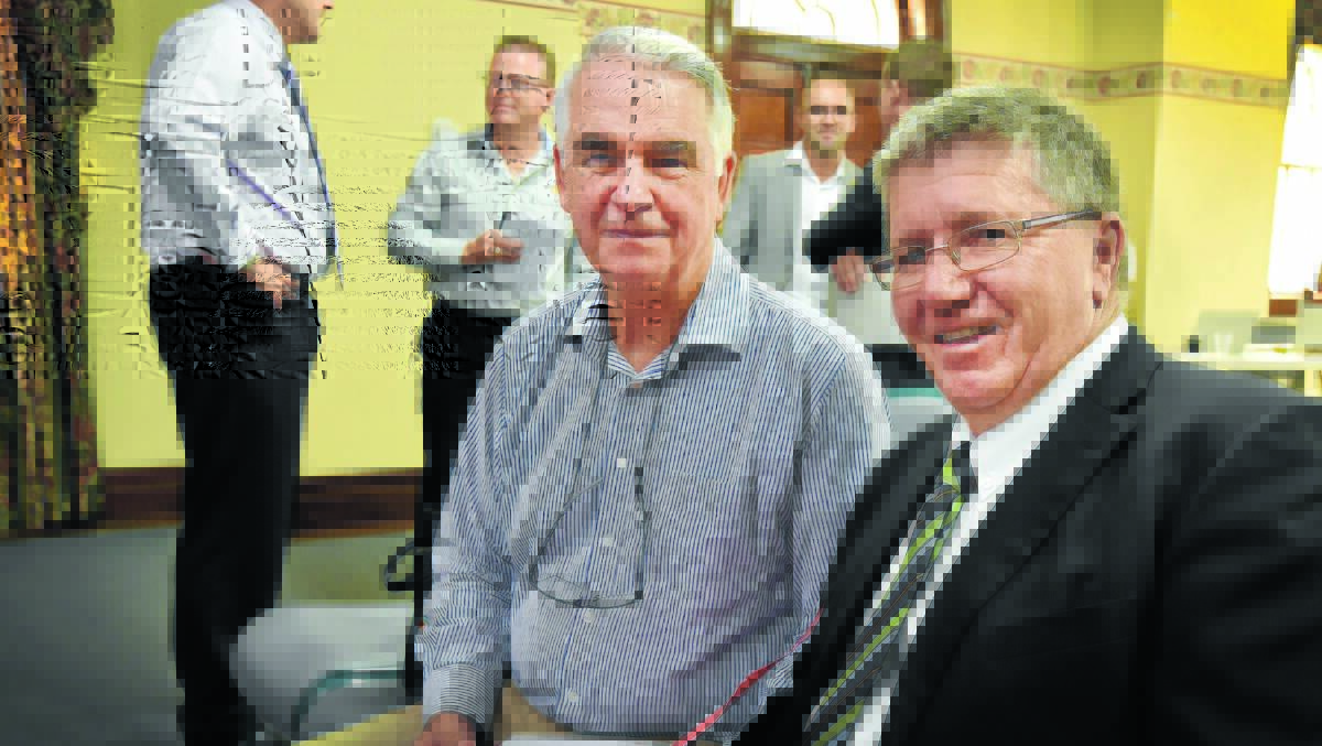 VITAL PROJECT: Ken Gillespie and Col Murray talk business. Photo: Geoff O’Neill 030216GOD03