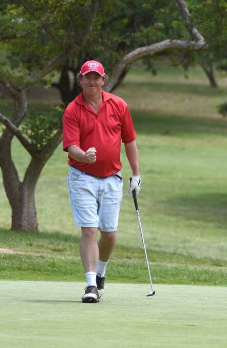Mark Jackson celebrates sinking this crucial putt on his way to an Armidale jug with playing partner Bruce Rankmore. Photo: pixonline.com.au