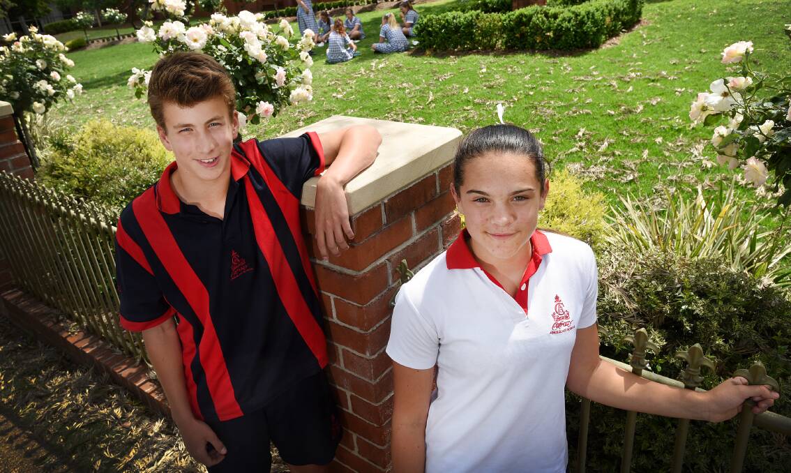William Burnett and Emma Klasen have returned to Calrossy with some bling after the two Years Seven students  conquered the NSW All Schools Athletics carnival last weekend. Photo: Gareth Gardner 141015GGB02