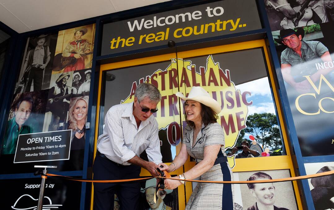 RIGHT – COME ON IN: Lindsay Butler and Dianne Lindsay cut the ribbon to officially open the Australian Country Music Hall of Fame. 160116GGB14