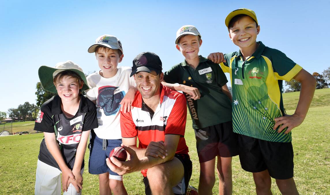 Among the youngsters at Brendan Lyon’s cricket camp at Farrer yesterday were (from left) Eoin Shepherd (11), Loomberah 11-year-old Oscar Newsome, Lyon,  Gunnedah’s Lachlan Straney (10) and a beaming Ben Chick (10). Photo: Gareth Gardner 011015GGA05