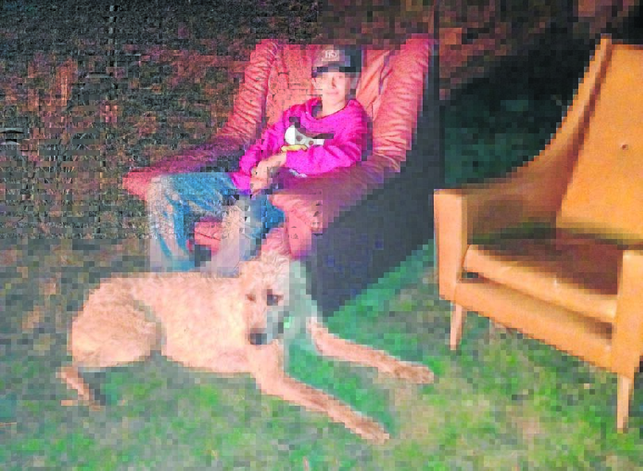 LOVED: Jayden and his dog, Slick, who he would dearly love returned to his family.