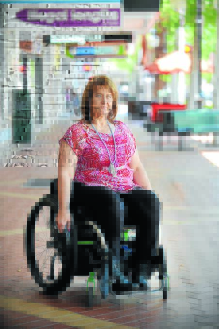 AT THE WHEEL: Tamworth local Cate Rae wants greater mindfulness from businesses shown toward patrons with disabilities. Photo: Barry Smith 301115BSB02