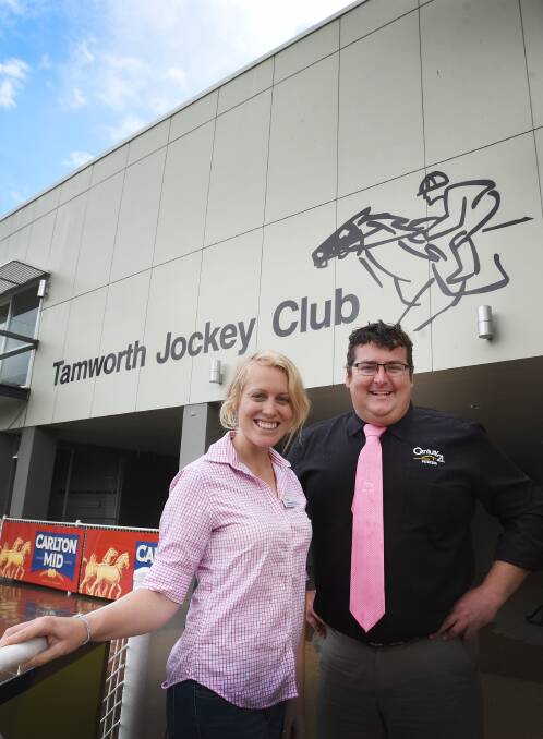 Pinking it up at the Tamworth Jockey Club are Ashleigh Worldon and Doug Selems.  
Photo: Gareth Gardner  221015GGB02