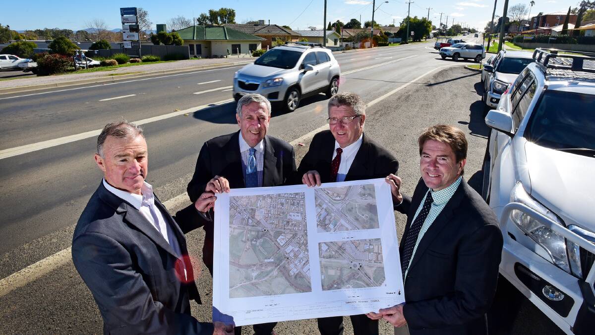 MAP TO THE FUTURE: Minister for roads Duncan Gay, second from left, is shown council’s plans for the Tribe St intersection by, from left, council regional services director Peter Resch, mayor Col Murray and member for Tamworth Kevin Anderson. Photo: Gareth Gardner 270715GGE02