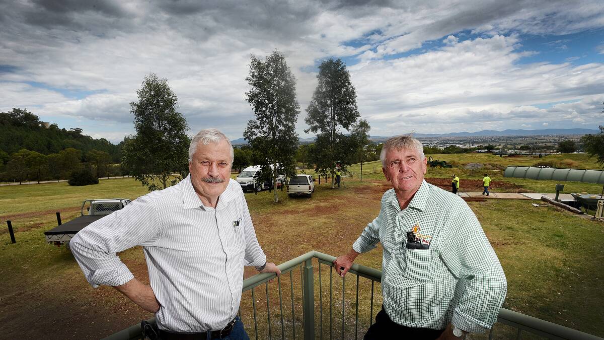 TAMWORTH CLUB: Vice-president of the Tamworth Regional Astronomy Club Garry Copper, left, with its publicity officer and Tamworth regional 
councillor Phil Betts on the site earmarked for an astronomy centre. Photo: Gareth Gardner 171215GGB02