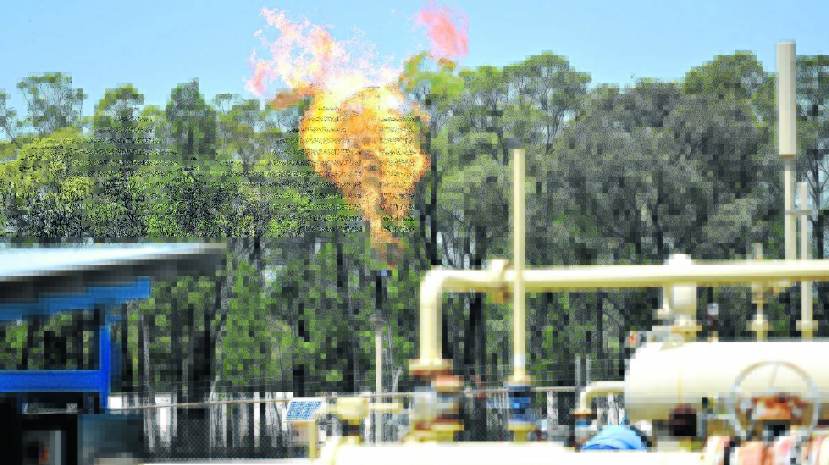 UP IN FLAMES: A gas flare goes off at Santos’s Pilliga gas well. Photo: Geoff O’Neill 050215GOA06