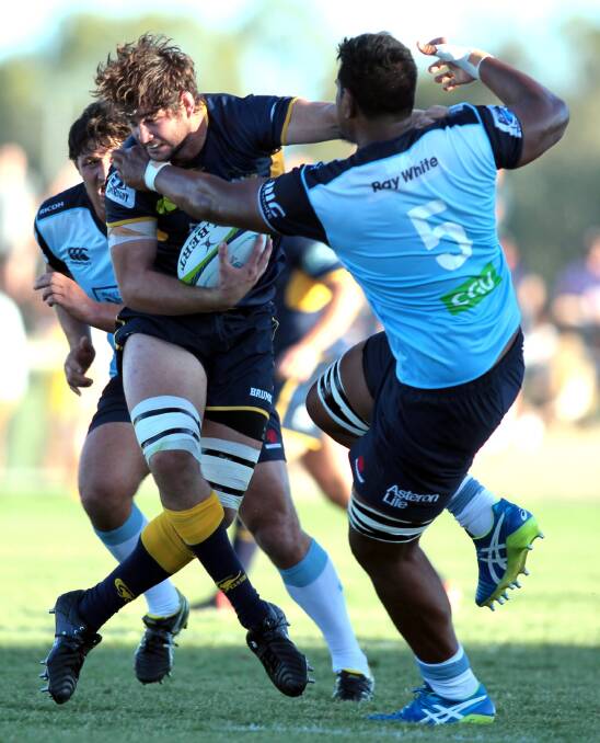 Quirindi’s Sam Carter gives Waratahs opposite Will Skelton the brush-off during last Saturday’s trial. Photo: Les Smith, The Daily Advertiser