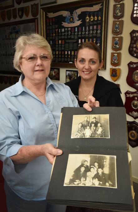 GOING HOME: Sandra Lambkin and Jayne McCarthy will return a World War II Japanese photo album to the family of the original owner in Japan next month. Photo: Geoff O’Neill 300915GOA02