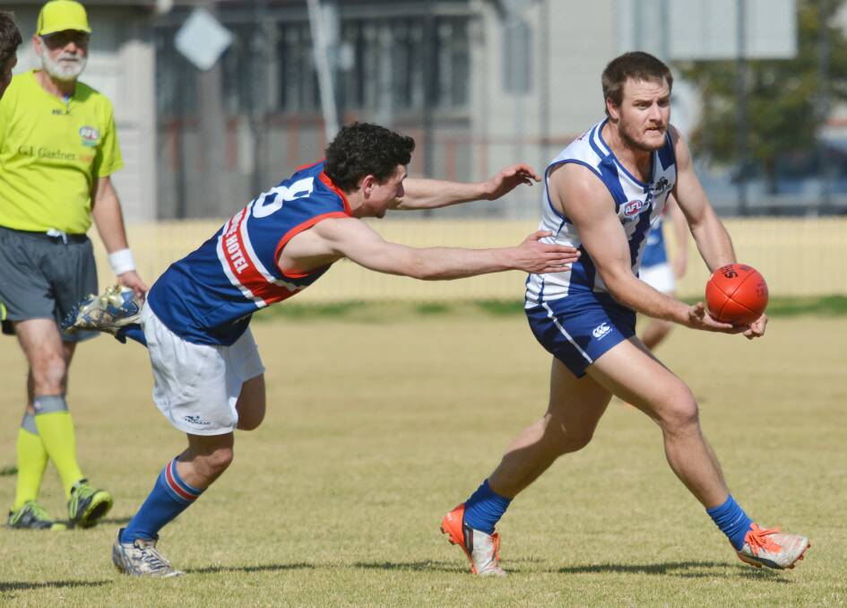 Gunnedah’s David Baker can’t rope in Tamworth Roos skipper Matt Hodge during the Roos’ big win at Wolseley Park on Saturday.  Photo: Barry Smith 220815BSA34