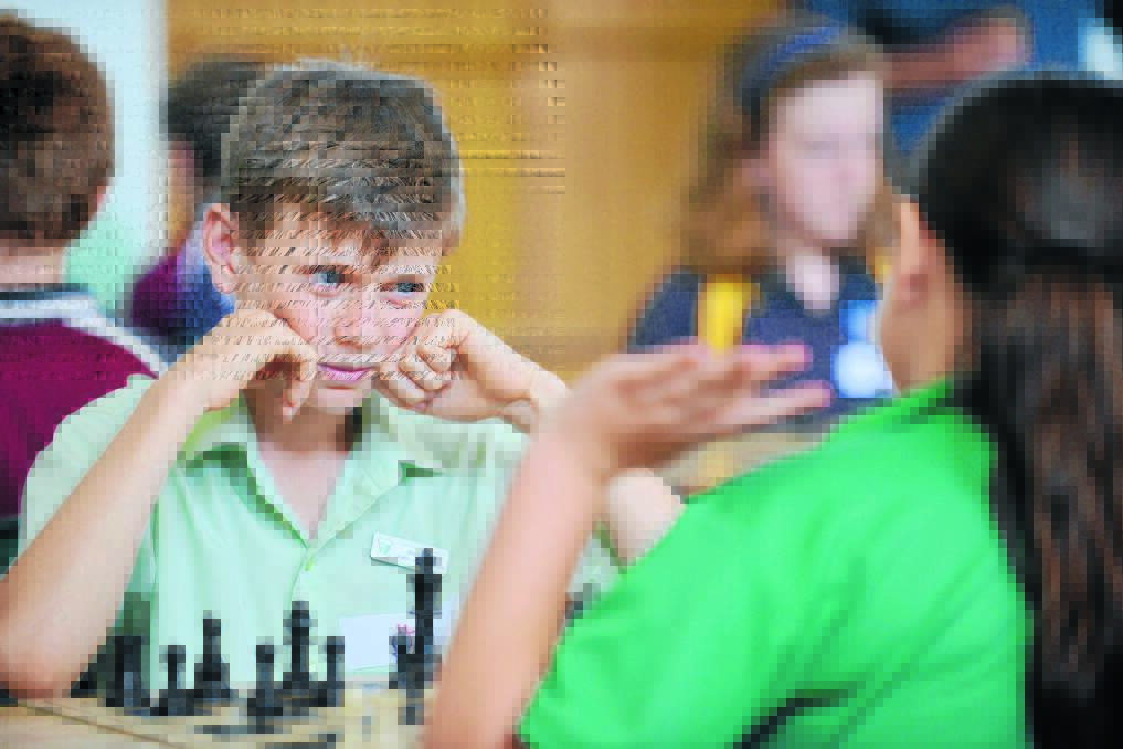 YOUR MOVE: Milo Atkinson from St Nicholas’ Tamworth eyes down his opponent during a tense battle. 271115BSA03