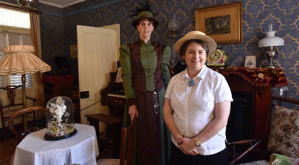 Melinda Gill embraced the spirit of the fair in period costume, here with Jennifer Porter. 130915GOD03