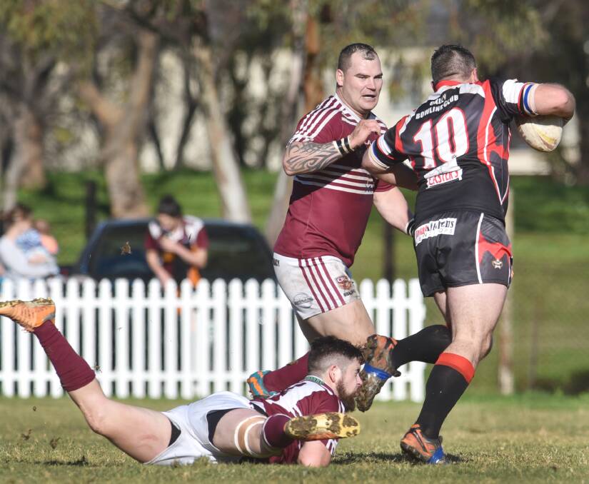 West ‘tank’ Chris Vidler comes across in cover to crunch North opposite Bill Jeffery after the Bears prop has slipped through the tackle of five-eighth Sam Taylor.
Photo: Barry Smith 260715BSE30
