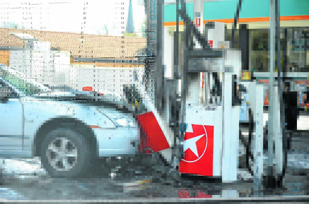 GOOD SAMARITANS: Two people were lucky to escape from a fire after hitting a petrol bowser in Armidale. Photo: Dannielle Maguire, Armidale Express