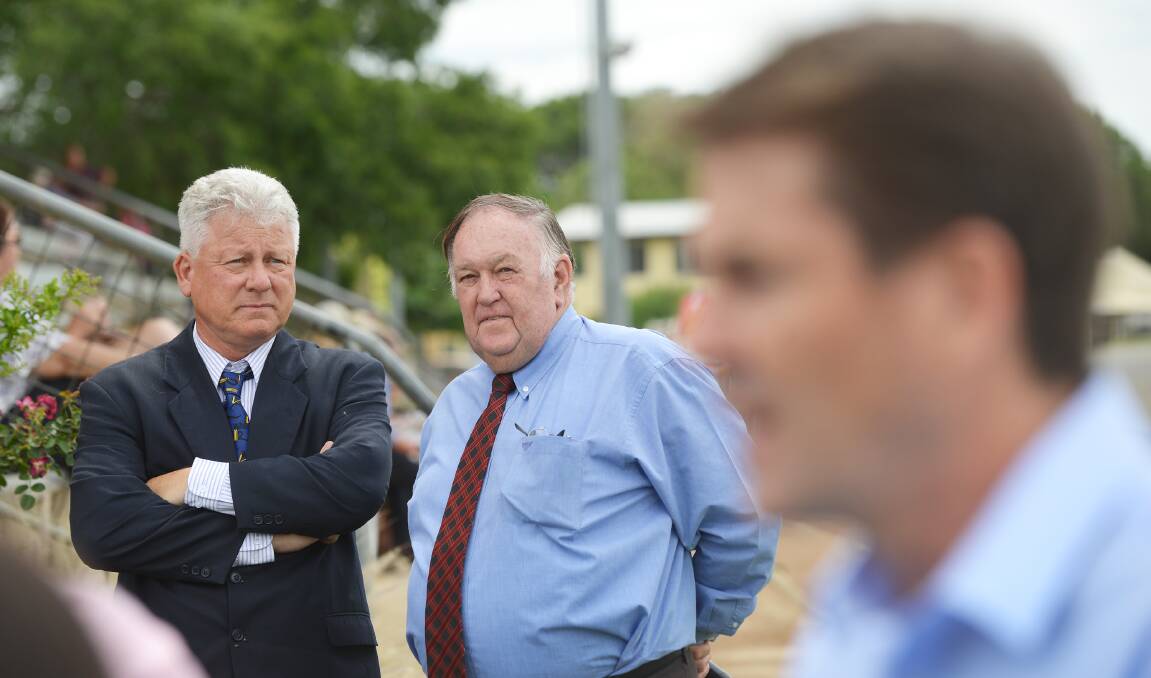 Tamworth Harness Racing Club president Terry Browne (left) and racecaller Bob Poetschka look on as Tamworth MP Kevin Anderson (foreground) savages Harness Racing NSW recently for their lack of action over a new harness racing complex .  
Photo: Barry Smith 121115BSB04