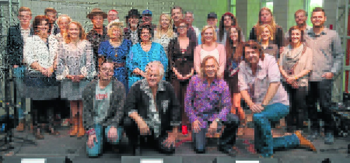 GROUP EFFORT: The Chris Austin Songwriting Contest finalists with judges Jesse Bellamy, Peter Rowan, Jim Lauderdale and Bruce Robison across the front.