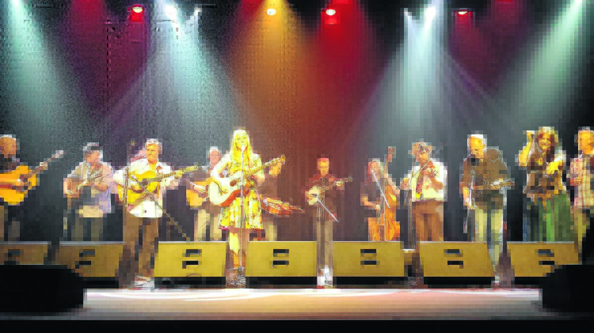 ALL TOGETHER NOW: This was the finale of Kristy Cox’s Bluegrass Comes to Tamworth show at the Capitol. It was a case of all hands on deck for the final few numbers. There’s a stack of talent on this stage. From left, Peter Cooper, Andrew Richardson, Dean Perrett (partly obscured), Jerry Salley, Glenn Skarratt, Kristy Cox, James Church, Martin Louis, Andy Toombs, Pete Denahy, Nigel Lever, Karen Lynne and Hugh Curtis. Fabulous musicians one and all. One of the best gigs I attended.