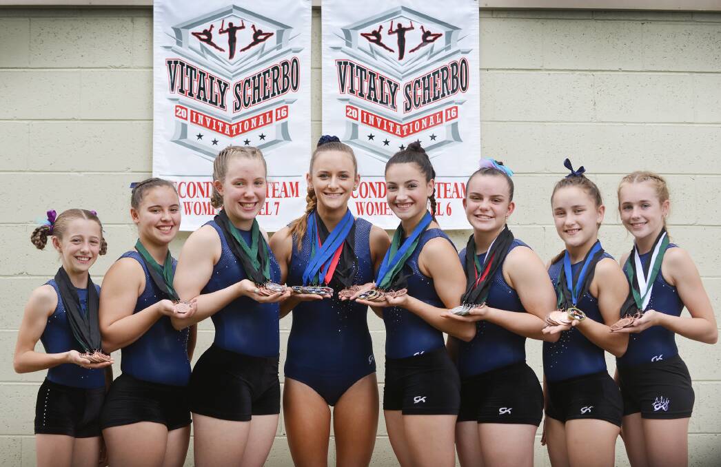Tamworth Gymnastics Club’s gymnasts show off their spoils from their recent US adventure (from left)  Paige Seaton, Lexi May, Ellie Hannaford, Georgia Pryer, Caitlin Ham, Julia Hannaford, Jemma Baker and Josie Douglas.  Photo: Barry Smith 280116BSF01