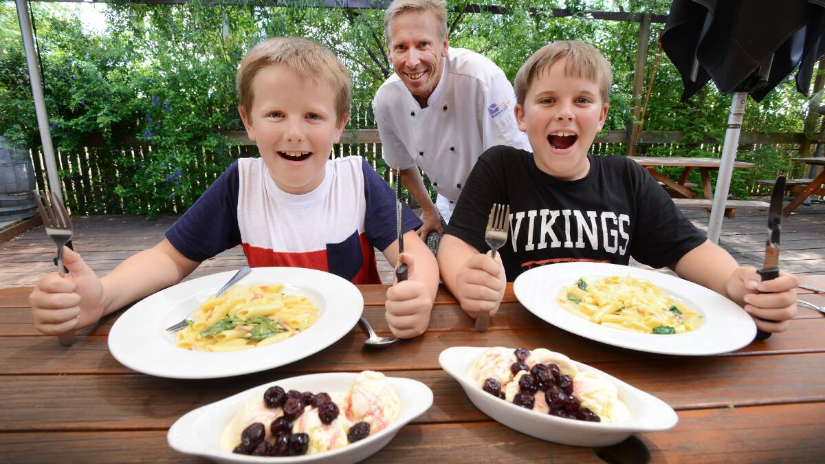 FOOD FOR THOUGHT: Square Man Inn owner Rob Breese with sons Riley, 8, and Ty, 9. Mr Breese says a bit of forethought and ingenuity can avoid the dreaded post-Christmas leftover conundrum. Photo: Barry Smith 241214BSC04