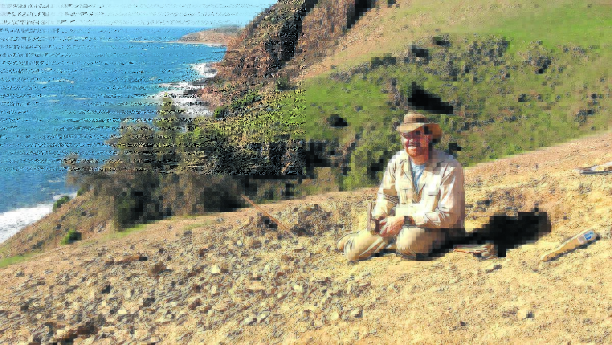 SPECTACULAR OFFICE VIEW: UNE Associate Professor John Paterson, pictured working in the field, has received a prestigious Australian science award.