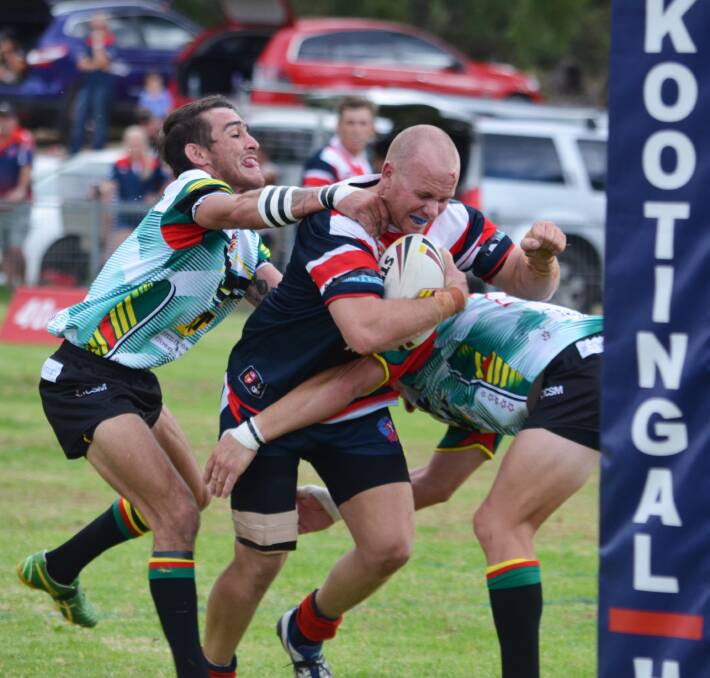 Wee Waa’s Scott Spencer (left)  and Joshua Carroll try to pull up a runaway Dan Greenwood in Kootingal on Saturday as the Roosters put Wee Waa to the sword in the back half. Photo: Chris Bath 300416CBA12