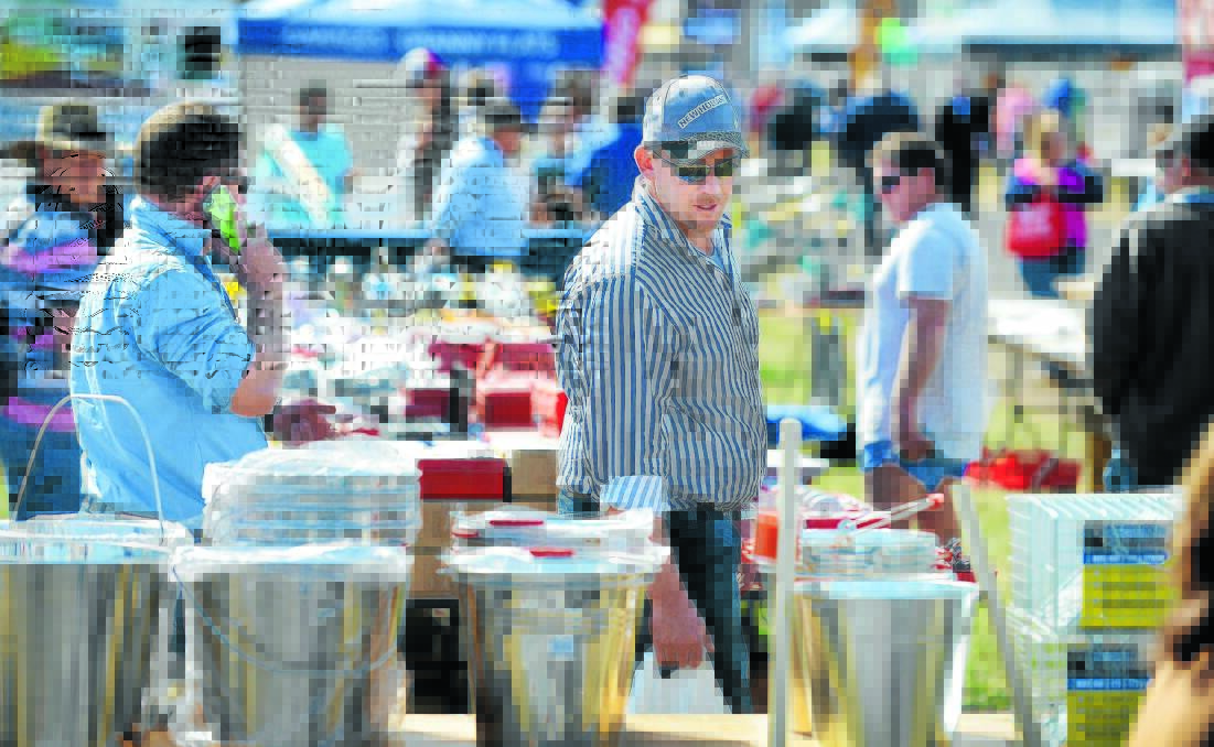 BUCKETS WAY: Just about everything is for sale at AgQuip, including metal buckets. Photo: Barry Smith 180815BSA59