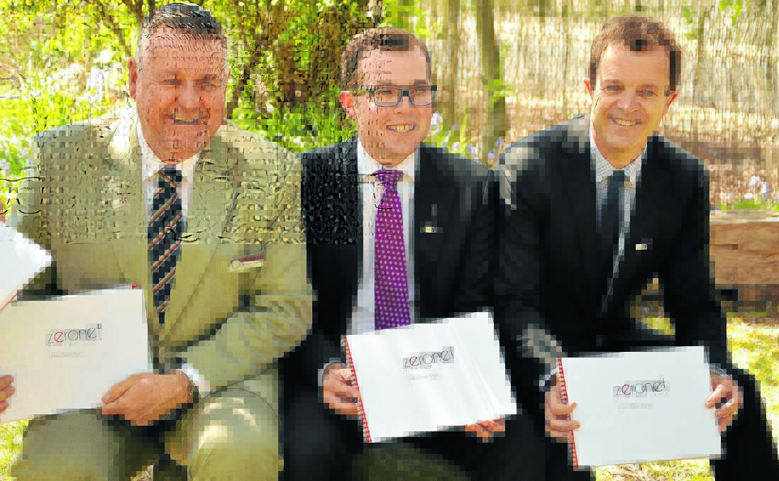BLUEPRINT FOR THE FUTURE: With their copies of the document that will help put Uralla on the nation’s renewable-energy map are, from left, mayor Michael Pearce, Northern Tablelands MP Adam Marshall and Environment Minister Mark Speakman.