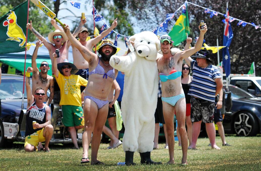 AUSTRALIA DAY SHENANIGANS: Darren Wilcox and all his B&S mates celebrated yesterday in quite an unusual way - bikinis! Front: Anthony Russo, left, Luke Currin (bear suit) and Luke Cowling caught the eye of many passers-by - and no wonder! Photo: Gareth Gardner 260115GGB01