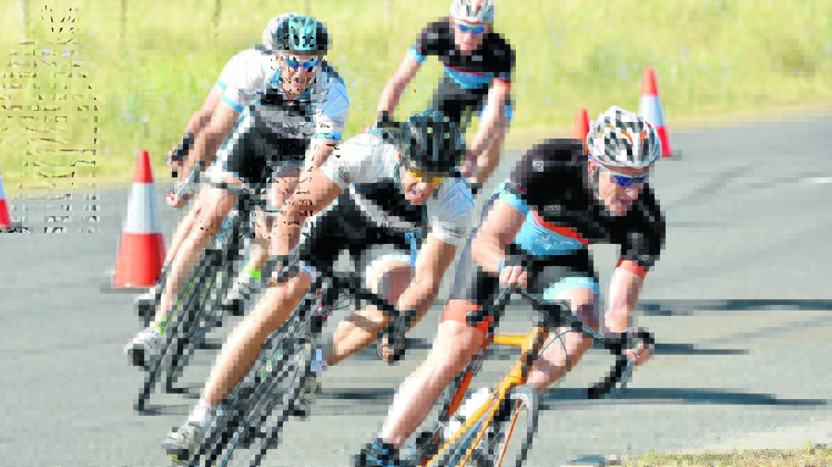 Darren Traill leads John Saunders and Daren Taylor into this turn during the early stages of yesterday’s A Grade criterium at Goddard Lane. Photo: Geoff O'Neill 061215GOA03