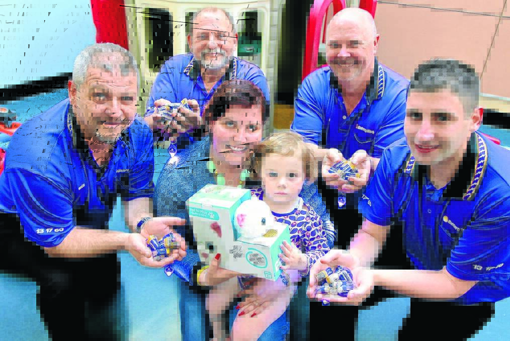 TOTALLY CHARGED: Battery World franchisees, from left, Greg Georgaros, Paul Simpson, Ian Powell and Daniel Fenech with mum Stevie Clarke and her daughter Zoe Hartley at Westmead Children’s Hospital.
