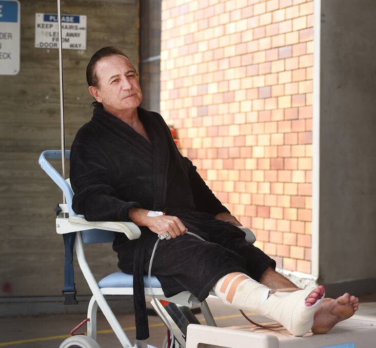 WAITING GAME: Dale Hooper was waiting yesterday on transport to fly him to Royal North Shore Hospital after a shocking altercation with an angle grinder. Photo: Gareth Gardner 060116GGA04