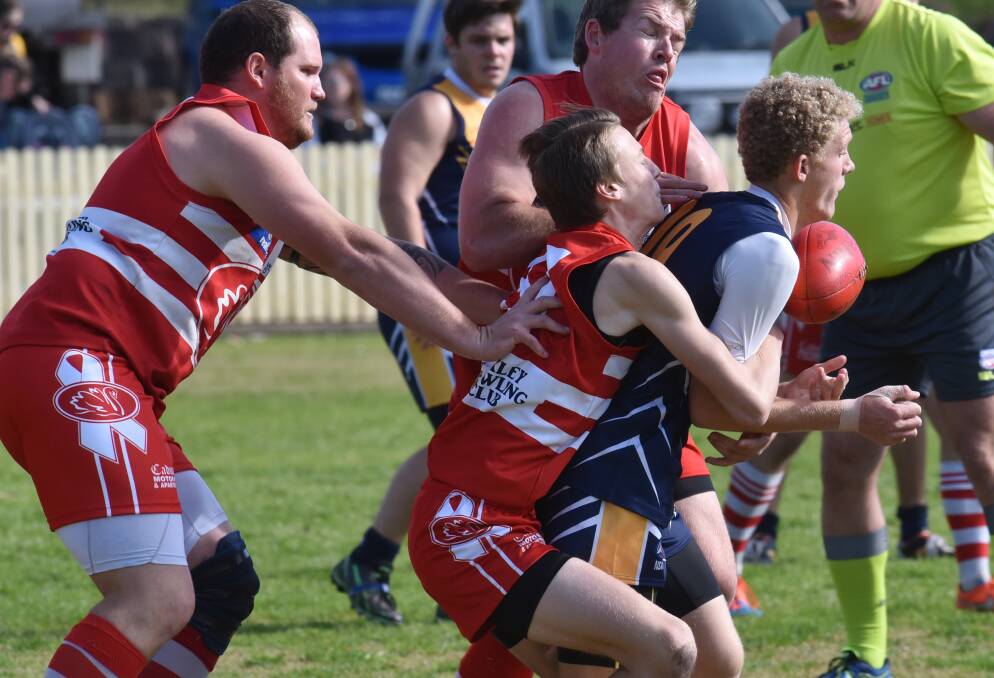 Narrabri’s Connor Robinson is sandwiched by Tamworth Swans Jordan Jeffries-Tapper (tackling) and James Dunstan as Chris Wilson comes in to assist during their clash on Saturday. Richarson was one of their best in their win on Saturday. Photo: Geoff O’Neill 010815GOB04