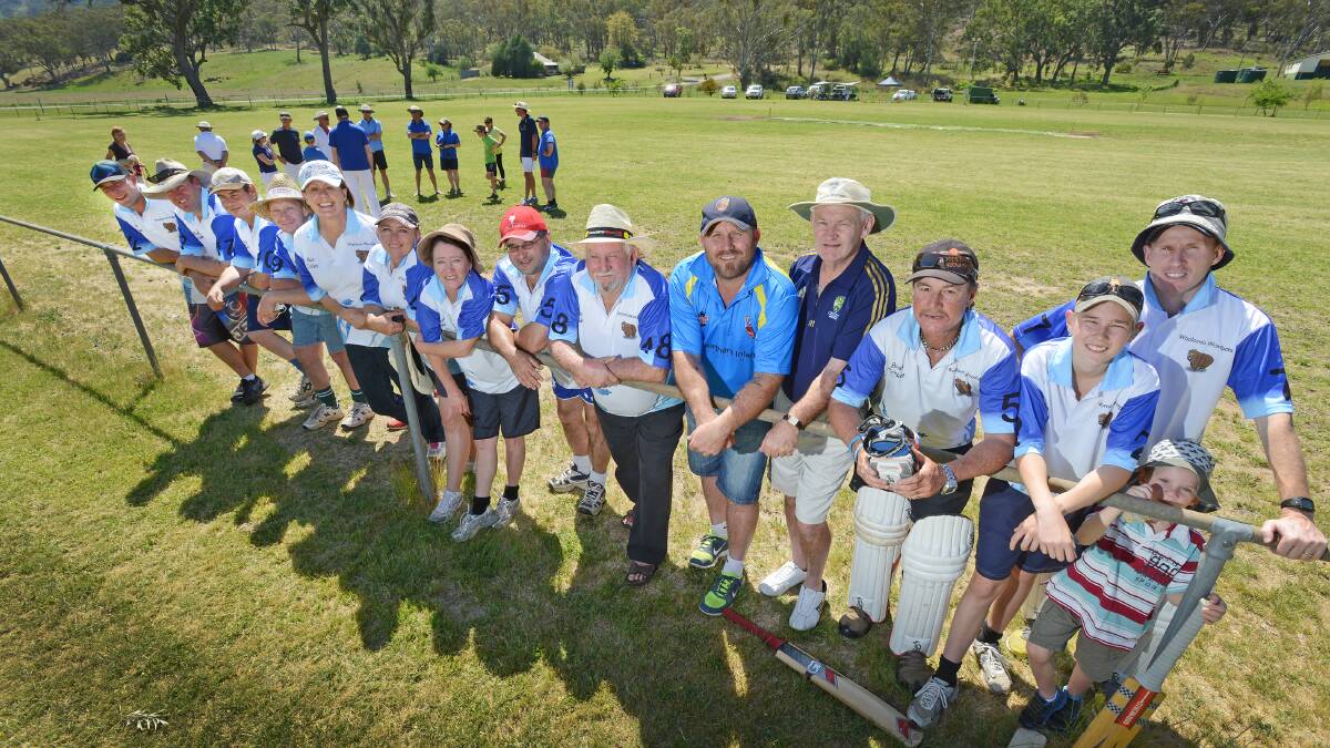 Woolomin team members Michael Seagrott, Brett Douglas, Dave Crowell, Jeffrey Pritchard, Judy Shadbolt, Amy O'Neill, Libby Nugent, Zoz Milo, George Olive, Marc Walton (captain), Zeb Douglas, Tim and Jake (4) Cotter, with Tamworth District Cricket Association president Richard Bullock (sixth from right) and Cricket NSW representative Mike Silver (fifth from right) at yesterday’s official opening of the club’s new pitch.  Photo: Barry Smith 051014BSB03