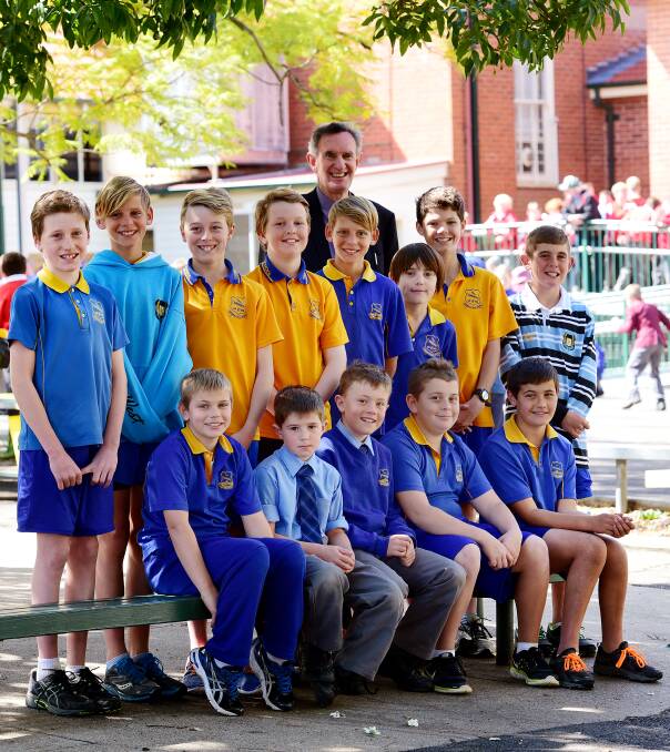 RIGHT: Tamworth Public’s hockey boys will be shooting for a state title at Narellan today. (Back from left) Jack Dadd, Ryan Taggart, Josh Morris, Kurt Barton, Chris Taggart, Codie Murphy, Lachlan Perry, Jacob Bird. (Front from left) Cameron Reading, Sam Bartlett-Taylor, Charlie Stone, Jackson Stanford and Lachlan Spark with  school principal Lee Preston.  Absent: Benji Stacey.  Photo: Gareth Gardner 040915GGC04