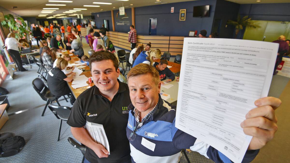 IMPORTANT DOCUMENT: UNE Enactus co-ordinator Koady Humphreys and The Minimbah Project national co-ordinator Will Winter at the birth certificate sign-up day at TRECC. Photo: Barry Smith 060815BSB01