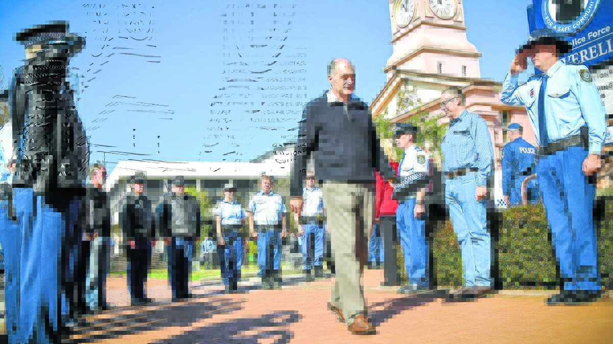 FOND FAREWELL: Senior Constable John Fleming is piped out of the Inverell Police Station yesterday morning by colleagues after calling it a day on his 36-year career in the force. Photo: Inverell Times