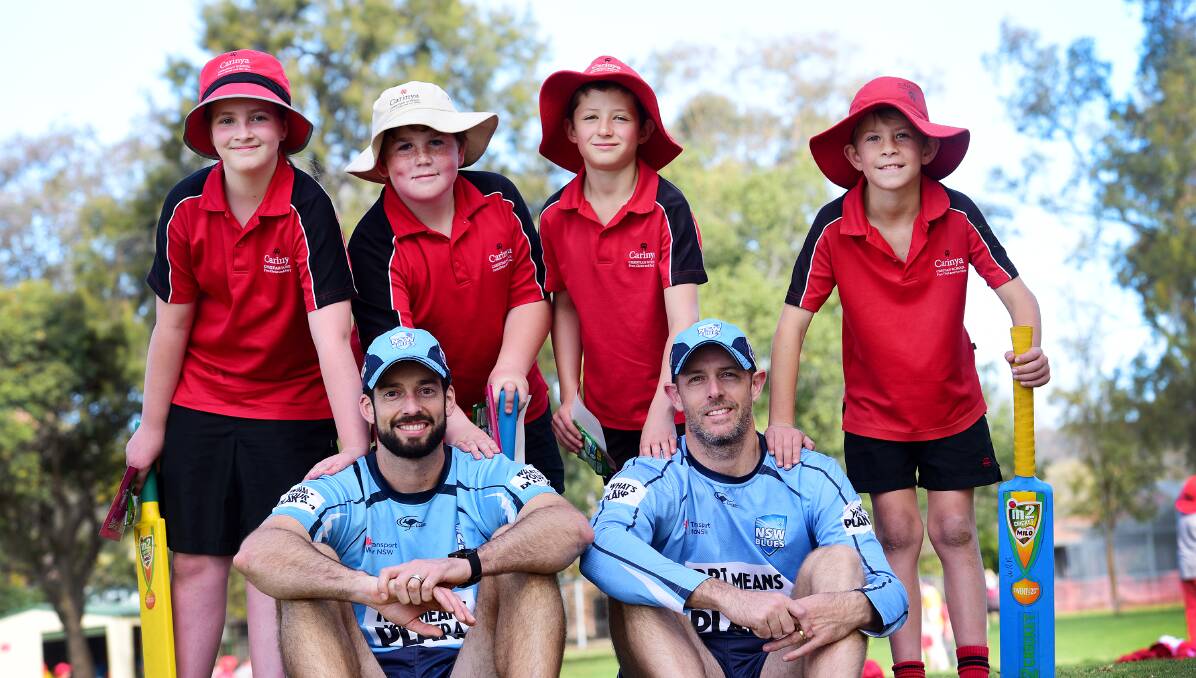 Carinya students (from left) Mia Kentwell, Izaiah Evens, Alastair Hewitt and Aidan King were getting some tips from NSW Blues players  Will Somerville (left)  and Ben Rohrer in Gunnedah on Wednesday. Unfortunately rain foiled yesterday’s Tamworth and Manilla clinics.  Photo: Gareth Gardner  020915GGB04
