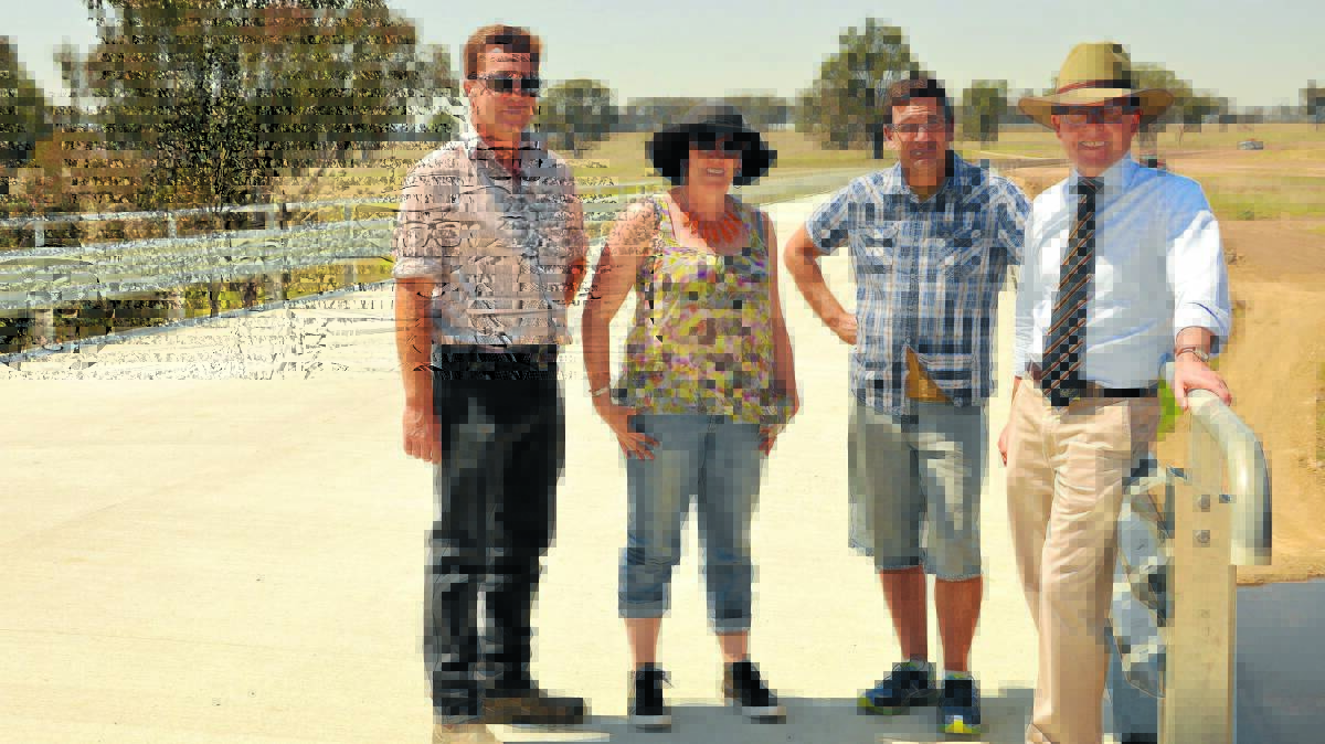 NEW ERA: The new Emu Crossing Bridge was officially opened to traffic yesterday and on hand to witness it were, from left, Spencer Hall from Bundarra Rural Supplies, Melissa and David Lowell from the Bundarra General Store and Northern Tablelands MP Adam Marshall.