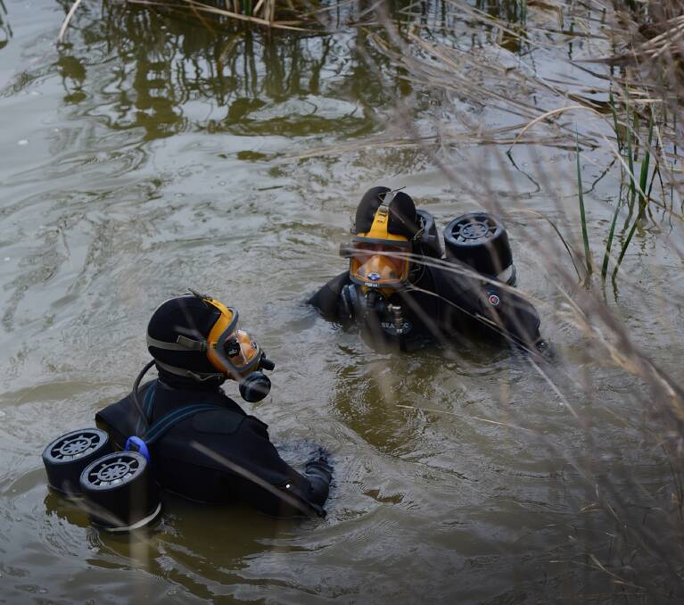 Police divers search Timbumburi Creek off Heiligmans Ln for clues to the disappearance of Johann Morgan. Photo: Gareth Gardiner 270815GGB10