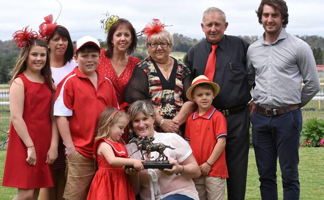Winning Spring Cup trainer Jenny Graham (middle front) celebrates the memorial win for the late Tony Hewitt with his family including parents Rhonda and Ross Hewitt (back row). Photo: pixonline.com.au