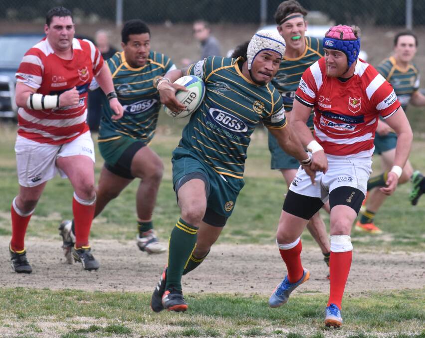 Walcha’s Andrew Taputoro moves in to try to close down Inverell flanker Liva Sili.  Photo: Geoff O’Neill 230815GOB29
