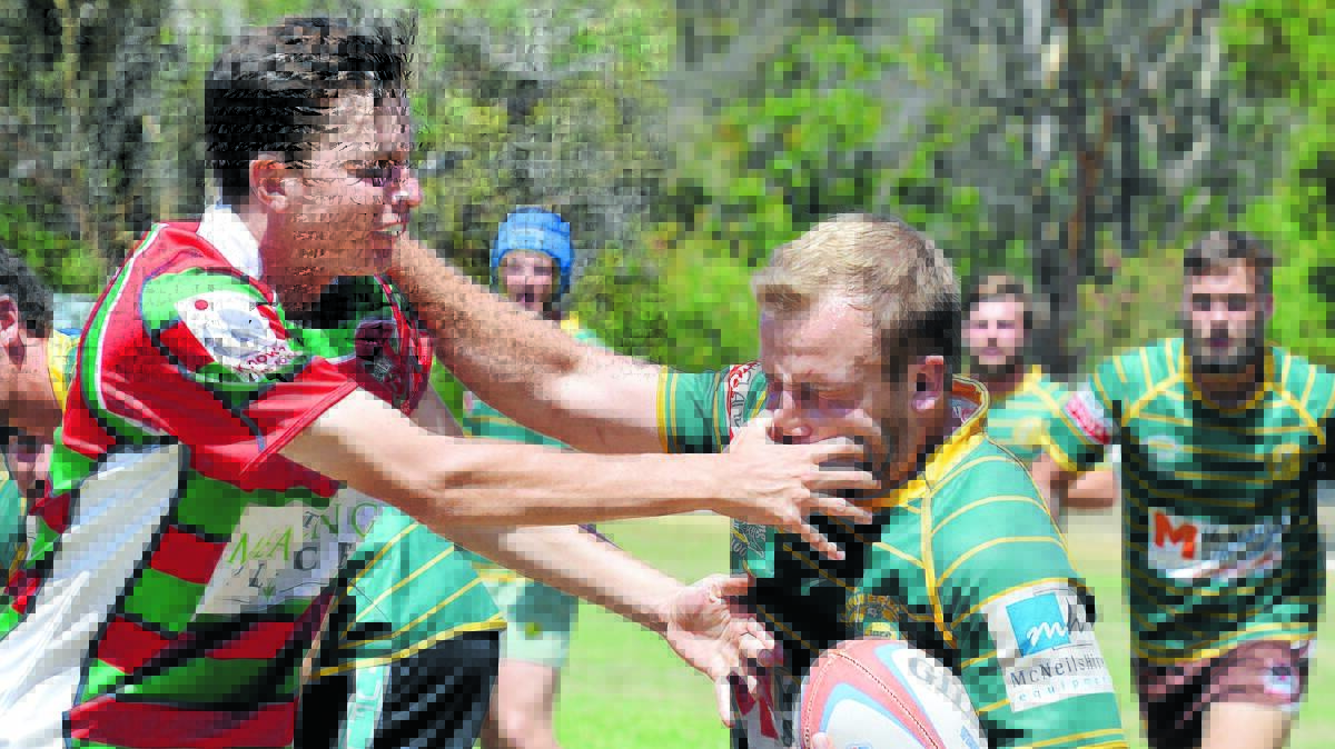 Inverell’s Scott Houston tries to avoid the dental treatment of St Alberts' Richie Burke during the Cup Final. Photos: Sam Newsam140316SNA14