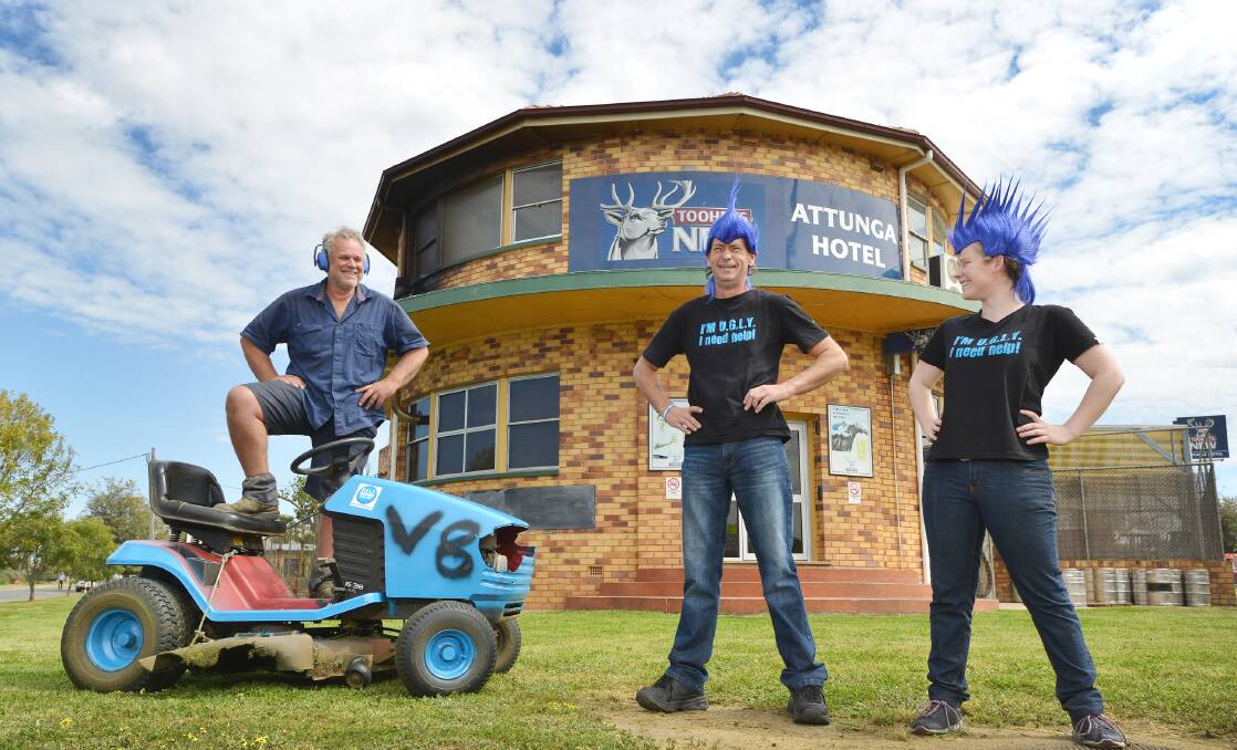 ATTUNGA UGLIES: Tony Percival reckons he’s the ugly grass cutter while publican Warren Miller and barmaid Chloe Dowe say ugly is the new beautiful for charity at their pub. Photo: Barry Smith  300915BSA01