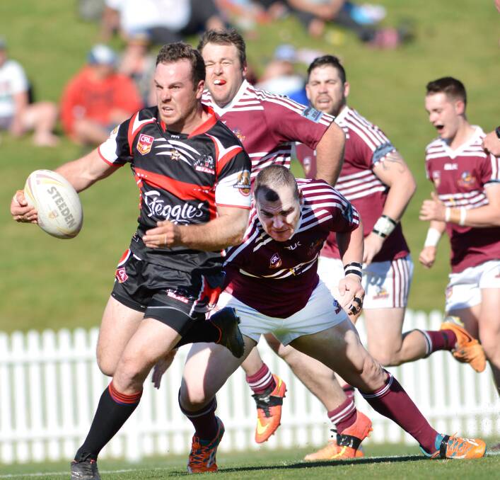 North hooker Scott Blanch evades West prop Chris Vidler during Sunday’s major semi-final.  Photo: Barry Smith 300815BSF62