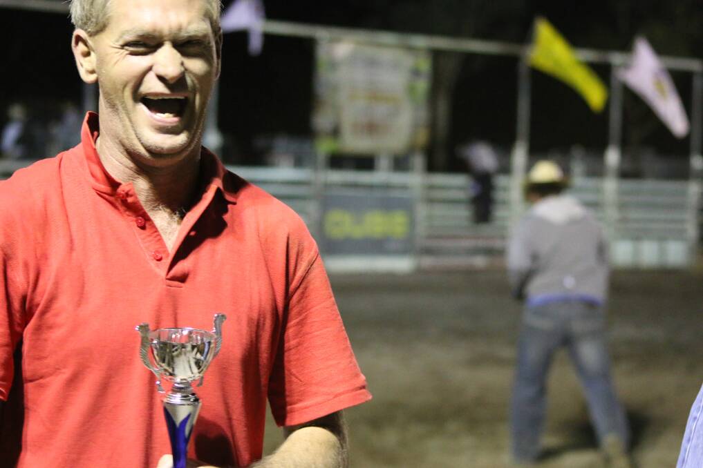 Warren Miller and his Cowhide Drag trophy from last weekend’s Attunga Downunder Rodeo. Photo: Debbie Turner