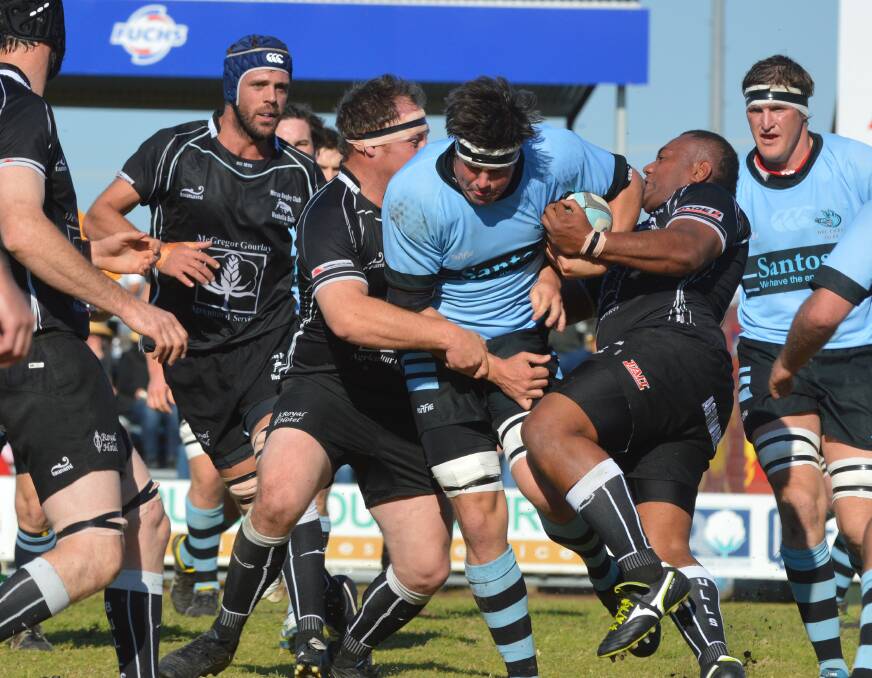 Moree’s John Adams (left) and Maciu Latabua team up to try to stop Narrabri second-rower Henry Curtin as Chris Clyne (left) and Joel Ballon (right) look on during the major semi-final two weeks ago. The rivals will do  battle again today for the Central North premiership. Photo: Samantha Newsam 150815SNA02