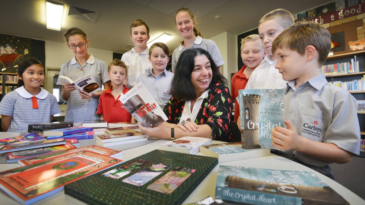 PLENTY OF TALENT: Author Sophie Masson with Carinya students Dione Gonzales, Felicity Roach, Cooper Cramp, Mitch Clark, Connor Finucane, Katie Hutton, Ryan Greenwood, Thomas Hanneman and Ethan Wallis. 091115BSC02